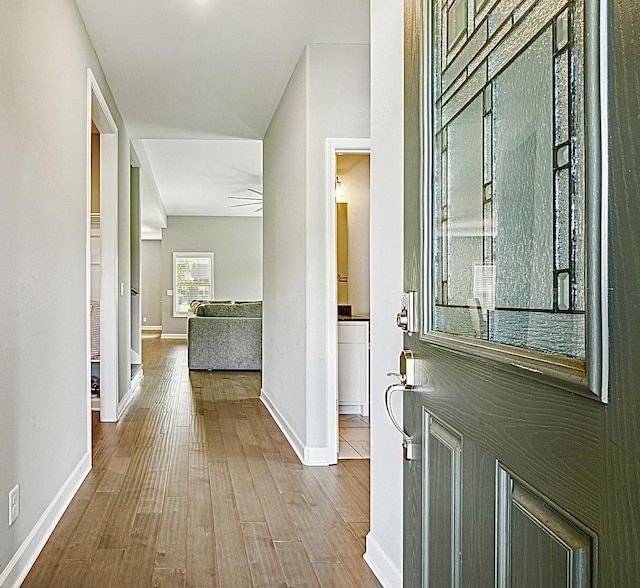 entryway with hardwood / wood-style flooring