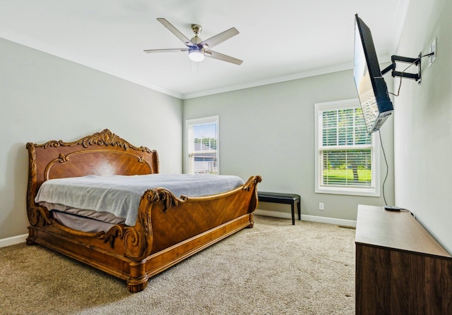 carpeted bedroom featuring ceiling fan, ornamental molding, and multiple windows