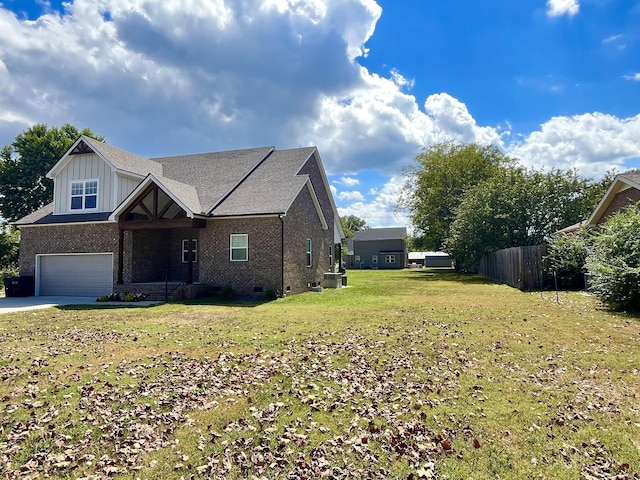 view of front facade featuring a garage and a front lawn