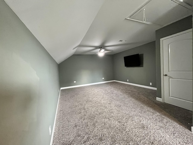 bonus room featuring ceiling fan, vaulted ceiling, and carpet