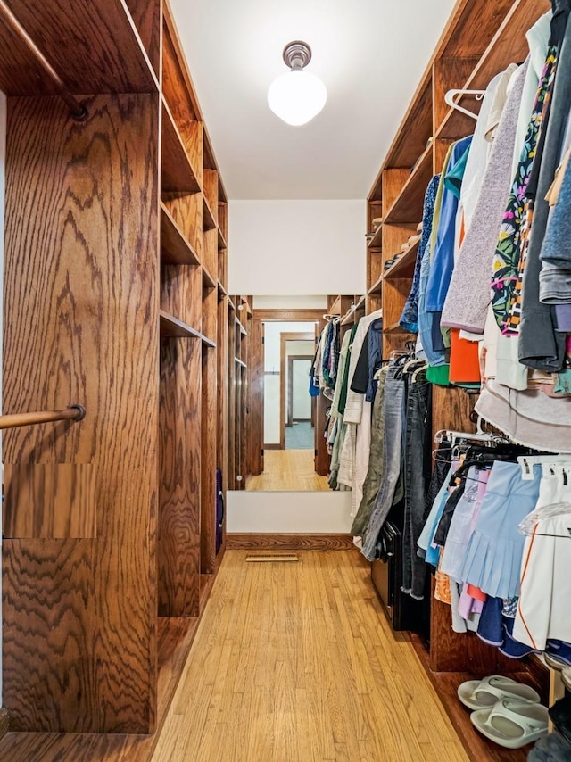 walk in closet featuring light hardwood / wood-style floors