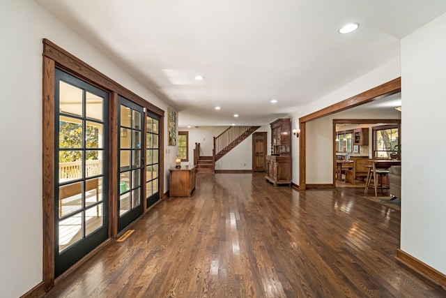 corridor featuring dark hardwood / wood-style floors