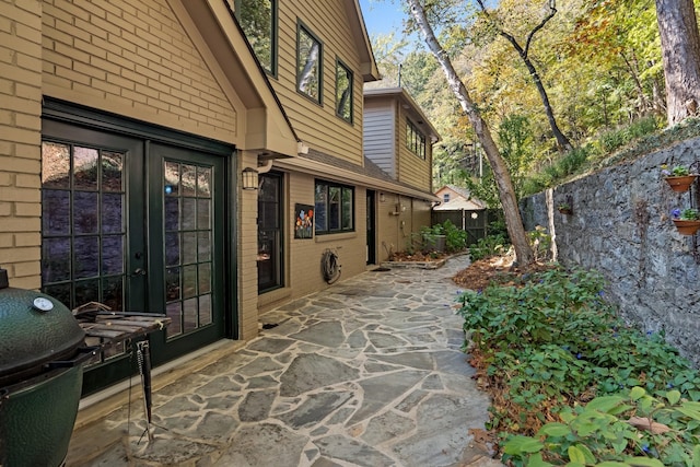 view of patio / terrace with a grill and french doors