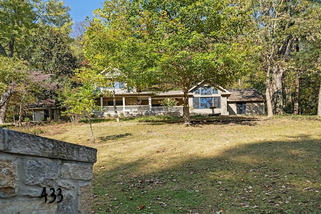 view of yard with covered porch