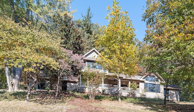 obstructed view of property with covered porch