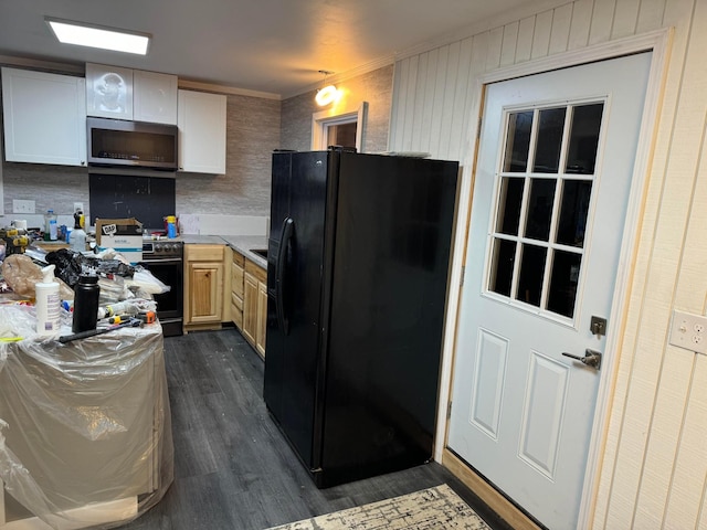 kitchen with dark hardwood / wood-style flooring, ornamental molding, appliances with stainless steel finishes, and light brown cabinetry