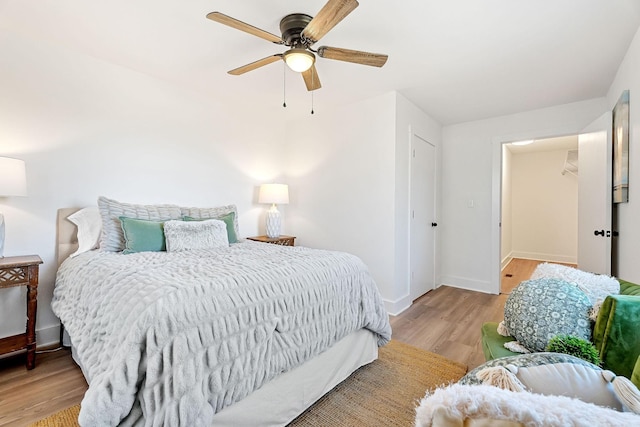 bedroom featuring ceiling fan and light hardwood / wood-style floors