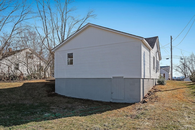 view of property exterior with a yard