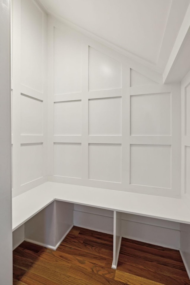 mudroom with vaulted ceiling and wood finished floors