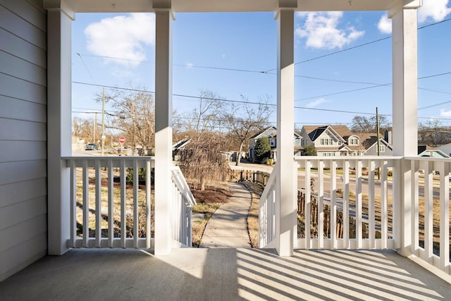 balcony featuring a porch and a residential view