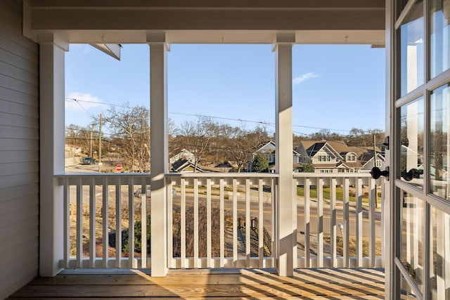 wooden terrace featuring a residential view