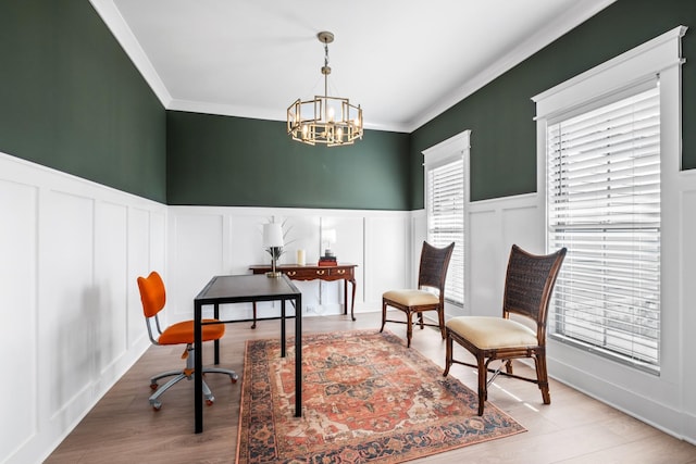 office with crown molding, light hardwood / wood-style flooring, and a notable chandelier