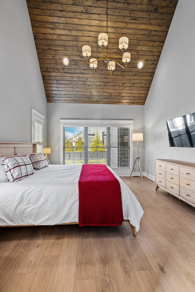 bedroom with wooden ceiling, hardwood / wood-style floors, and high vaulted ceiling