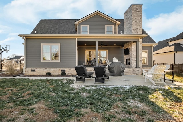 back of house featuring a patio area, a yard, and ceiling fan