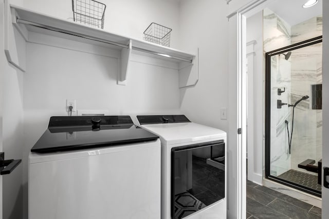 laundry room featuring washing machine and clothes dryer