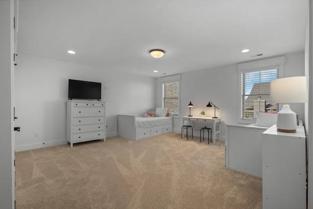 bedroom featuring light colored carpet