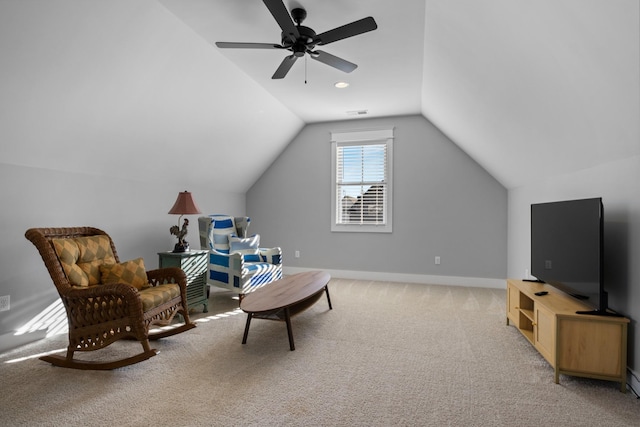 living area with light carpet, ceiling fan, and lofted ceiling