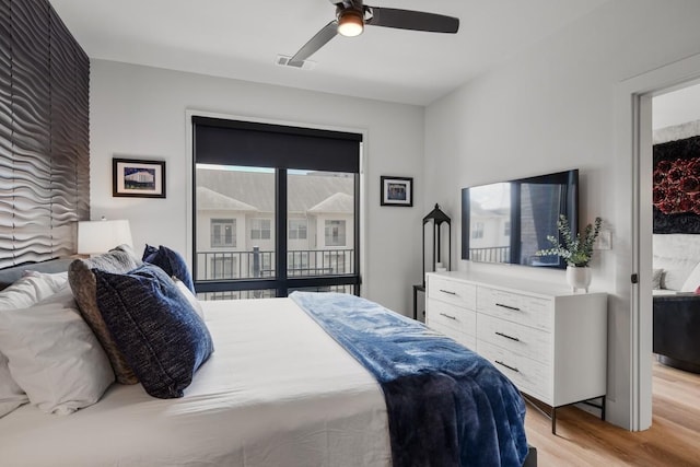 bedroom with ceiling fan and light wood-type flooring