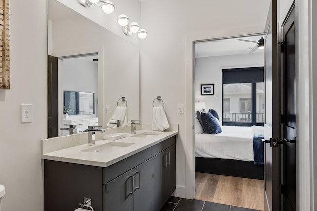 bathroom featuring tile patterned floors, ceiling fan, and vanity