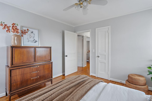 bedroom featuring ceiling fan, hardwood / wood-style flooring, and crown molding