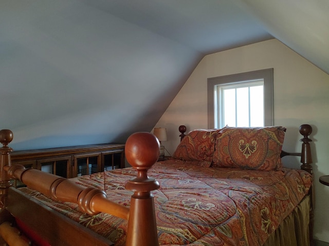 bedroom featuring vaulted ceiling