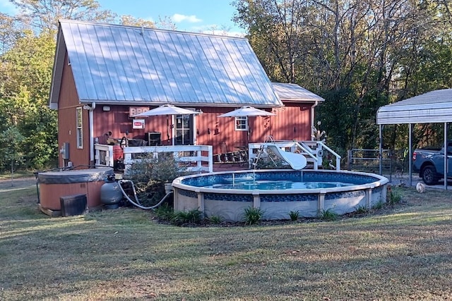 view of pool with a yard