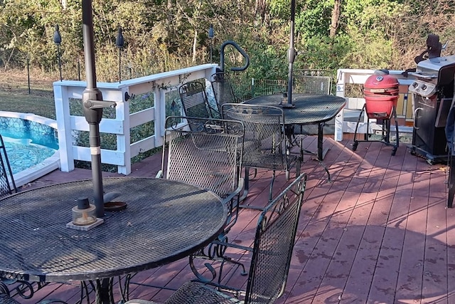 view of patio featuring area for grilling and a pool side deck