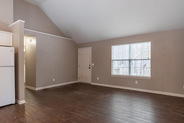 unfurnished living room featuring dark hardwood / wood-style flooring and vaulted ceiling