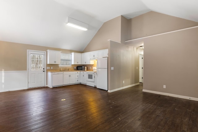 kitchen with white appliances, white cabinetry, sink, high vaulted ceiling, and dark wood-type flooring