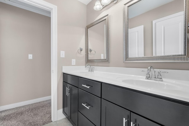 bathroom with tile patterned floors and vanity