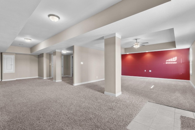 basement featuring ceiling fan and carpet floors