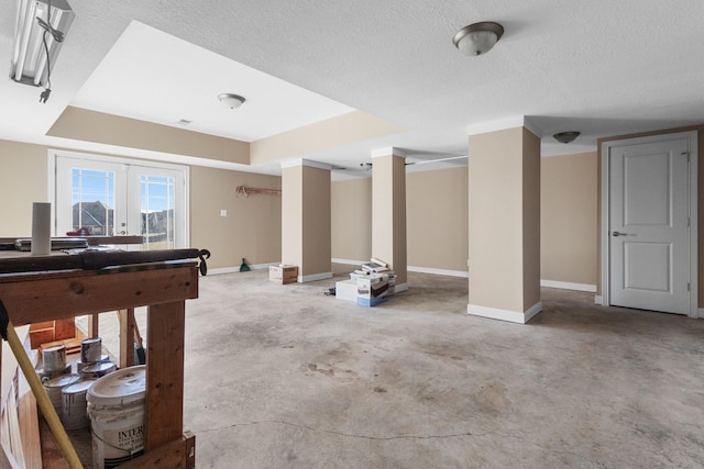 playroom with a textured ceiling and french doors