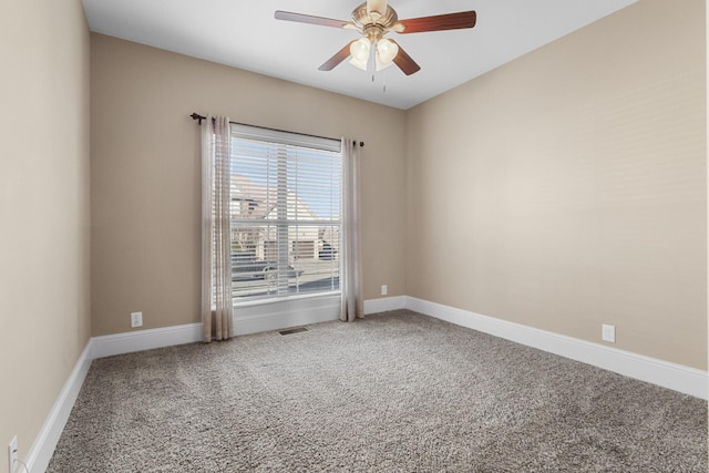 spare room with ceiling fan and carpet flooring