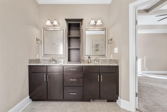 bathroom with vanity, tile patterned floors, and crown molding