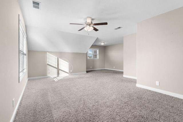 interior space featuring vaulted ceiling and ceiling fan