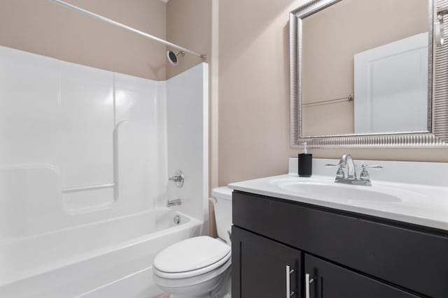 full bathroom with vanity, bathing tub / shower combination, and toilet