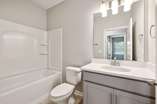 full bathroom featuring toilet, vanity, and washtub / shower combination