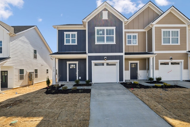 view of front of house with board and batten siding, an attached garage, and concrete driveway