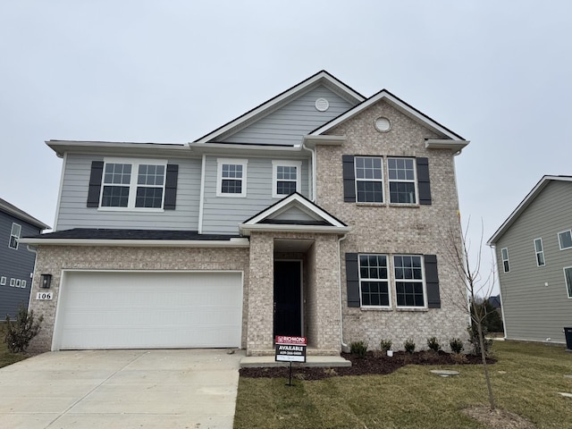 view of front facade with a garage and a front lawn