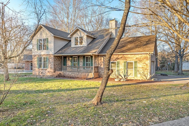 cape cod home featuring a front yard and a porch