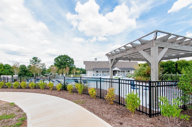 view of swimming pool with a pergola