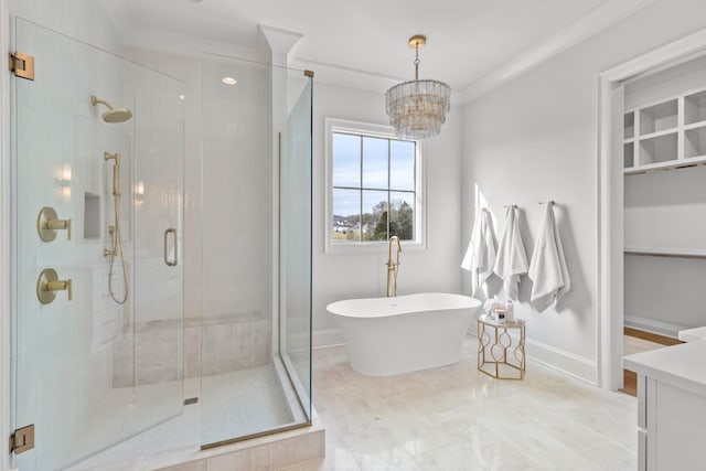 bathroom featuring separate shower and tub, an inviting chandelier, vanity, and ornamental molding