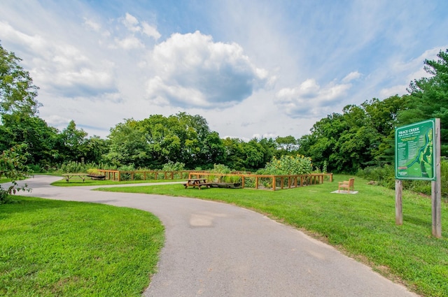 view of home's community with a lawn