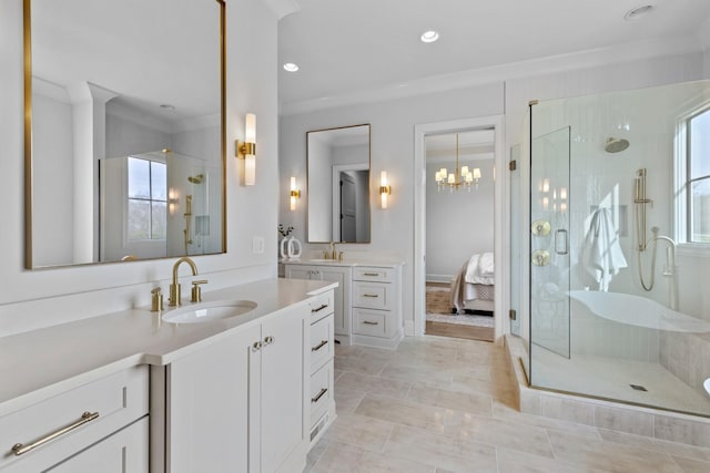 bathroom featuring vanity, crown molding, and a shower with door