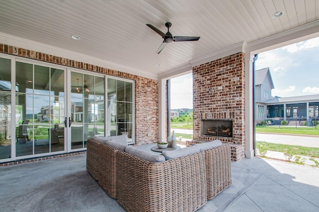 view of patio / terrace with ceiling fan and an outdoor brick fireplace