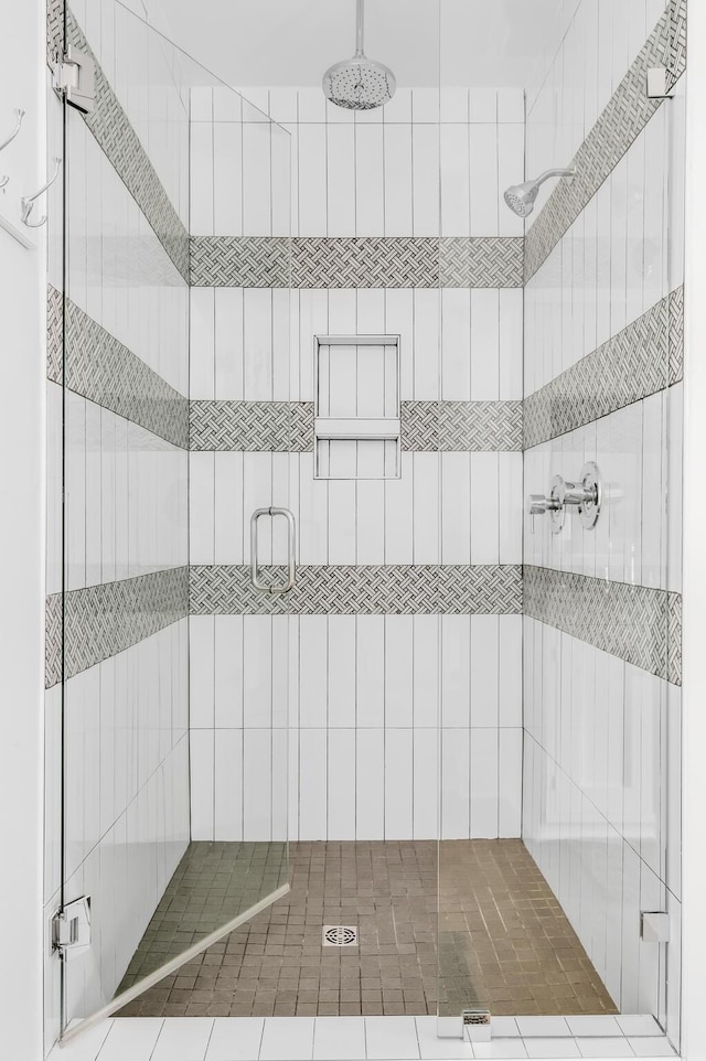 bathroom with a shower with shower door