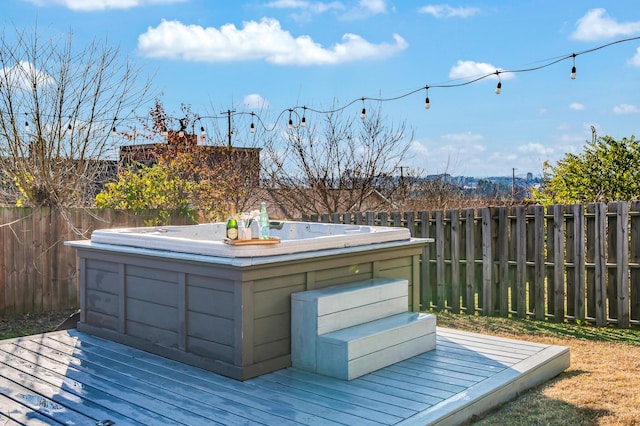 wooden terrace with a hot tub