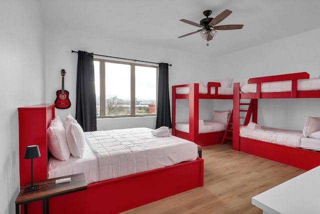 bedroom with light wood-type flooring and ceiling fan