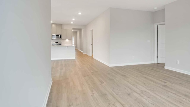 unfurnished room with light hardwood / wood-style floors