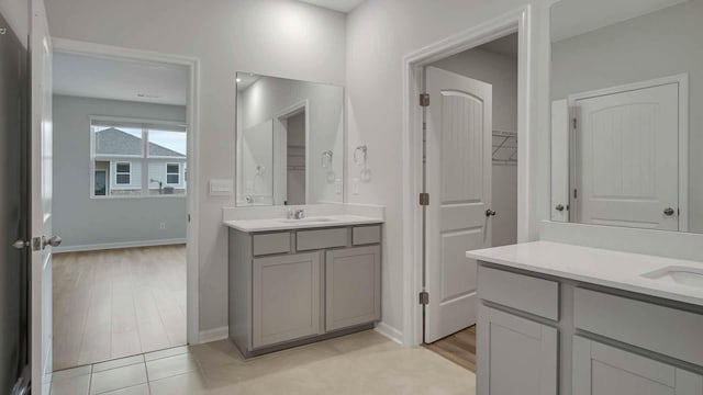 bathroom with tile patterned flooring and vanity